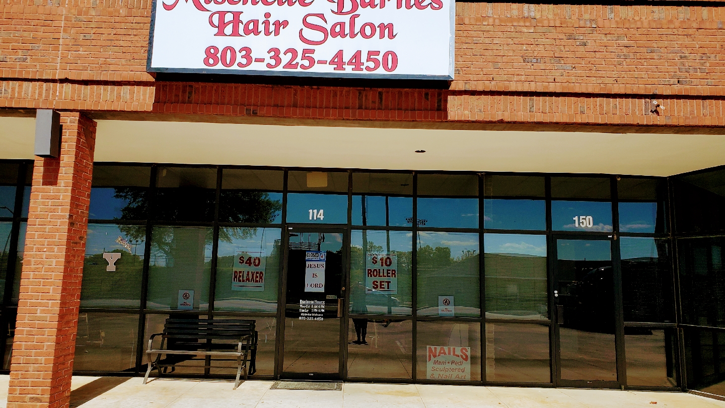 Salon storefront on S Cherry Rd with our phone number on the sign