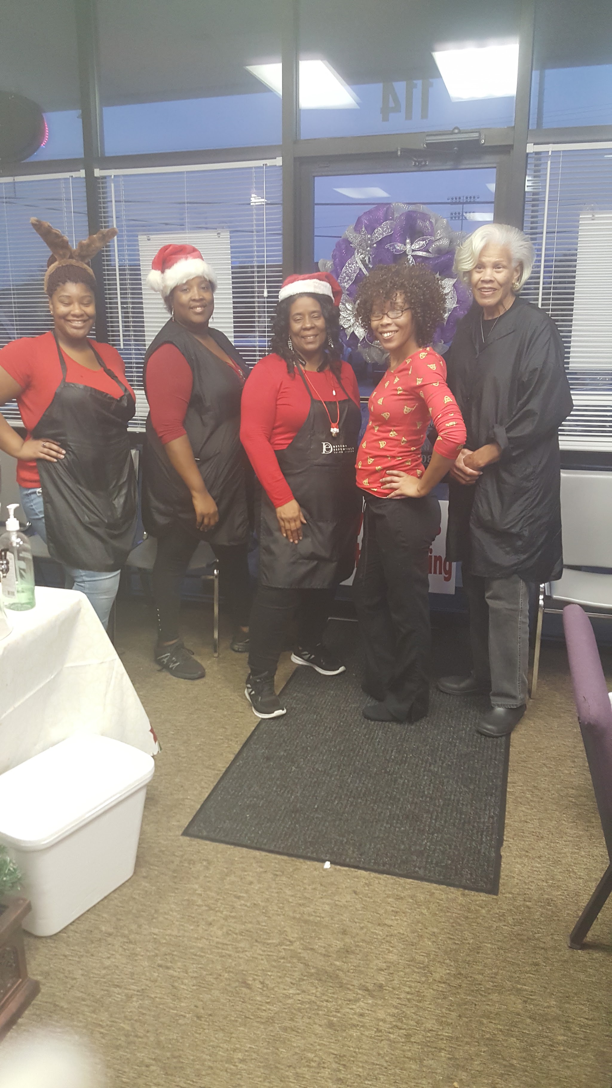 The salon team together in holiday outfits