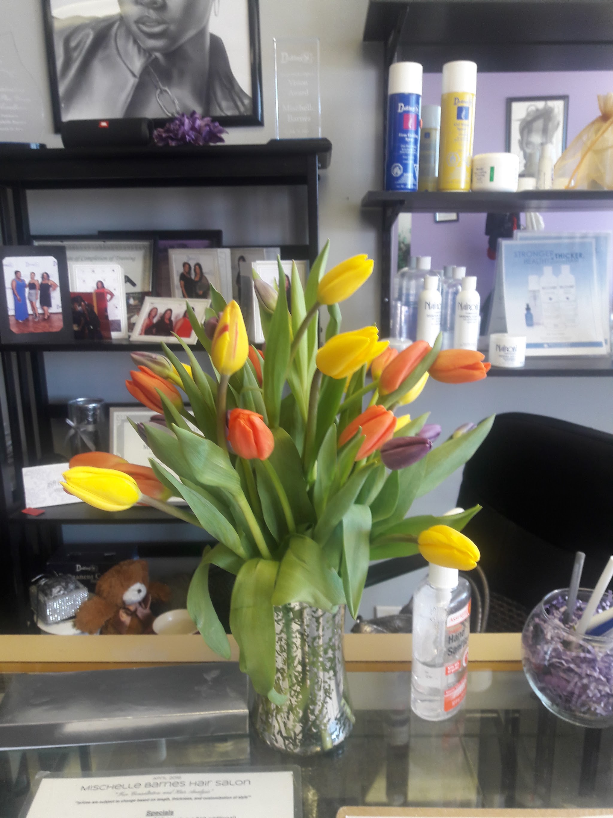 Tulips and hair care products on the salon shelf
