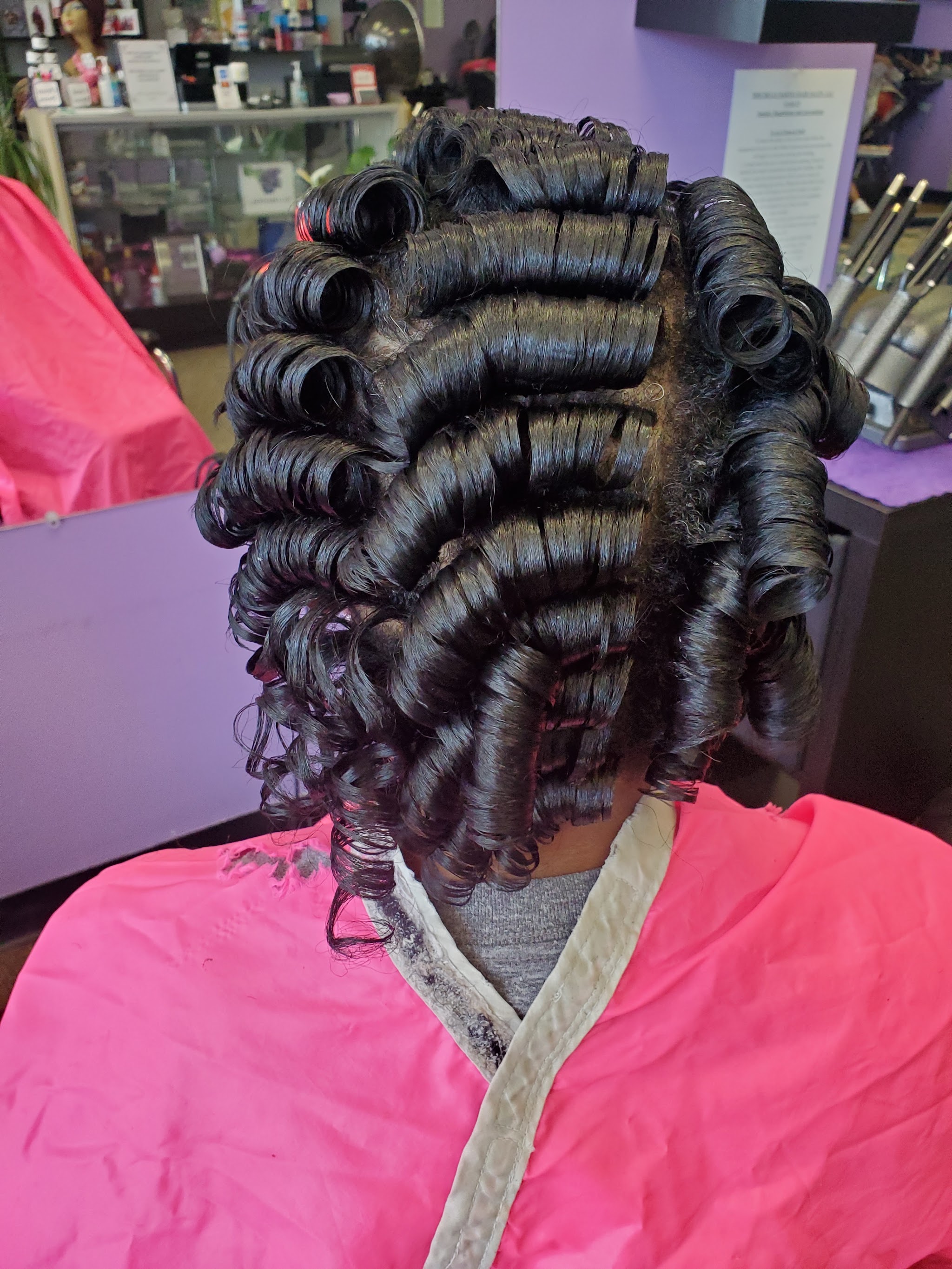 Black curl roller set from behind
